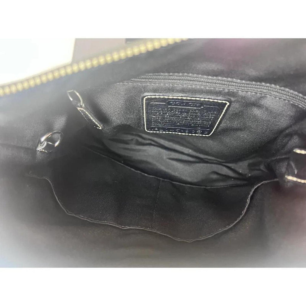 A classic Coach Signature Canvas Shoulder Bag in black and grey