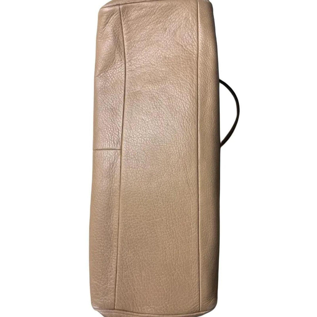 A stylish Coach Madison Kimberly Carryall Tote Bag in beige leather