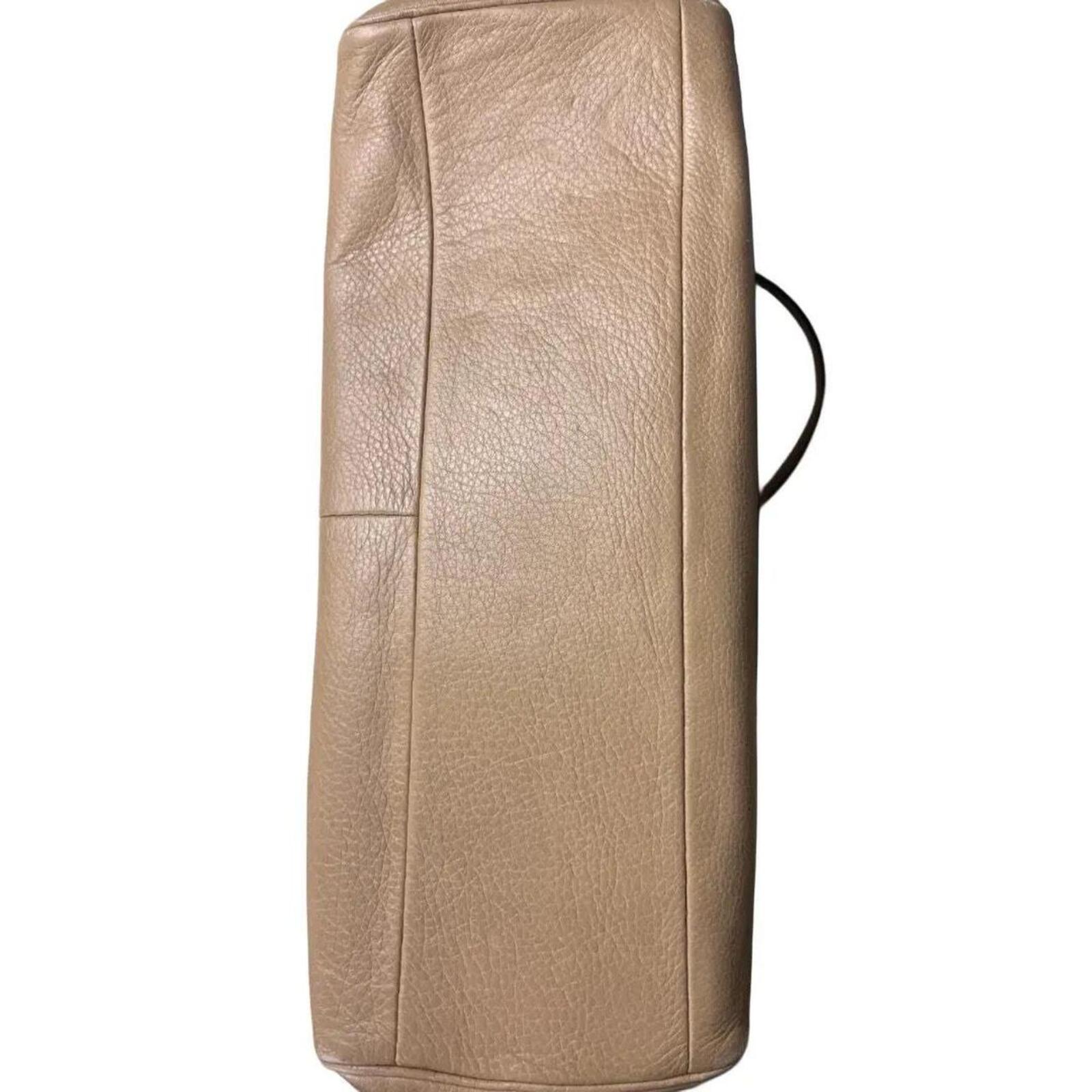A stylish Coach Madison Kimberly Carryall Tote Bag in beige leather