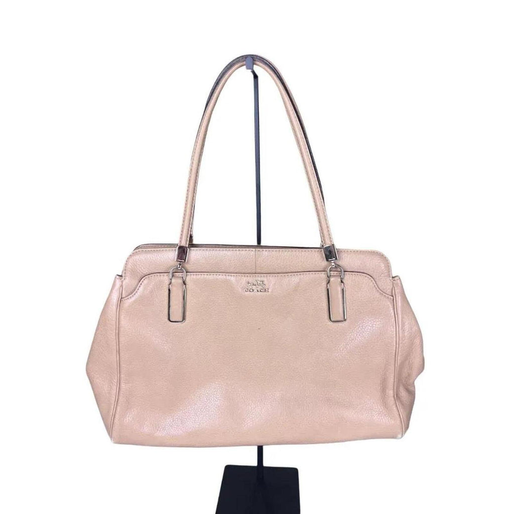 A stylish Coach Madison Kimberly Carryall Tote Bag in beige leather