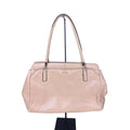 A stylish Coach Madison Kimberly Carryall Tote Bag in beige leather