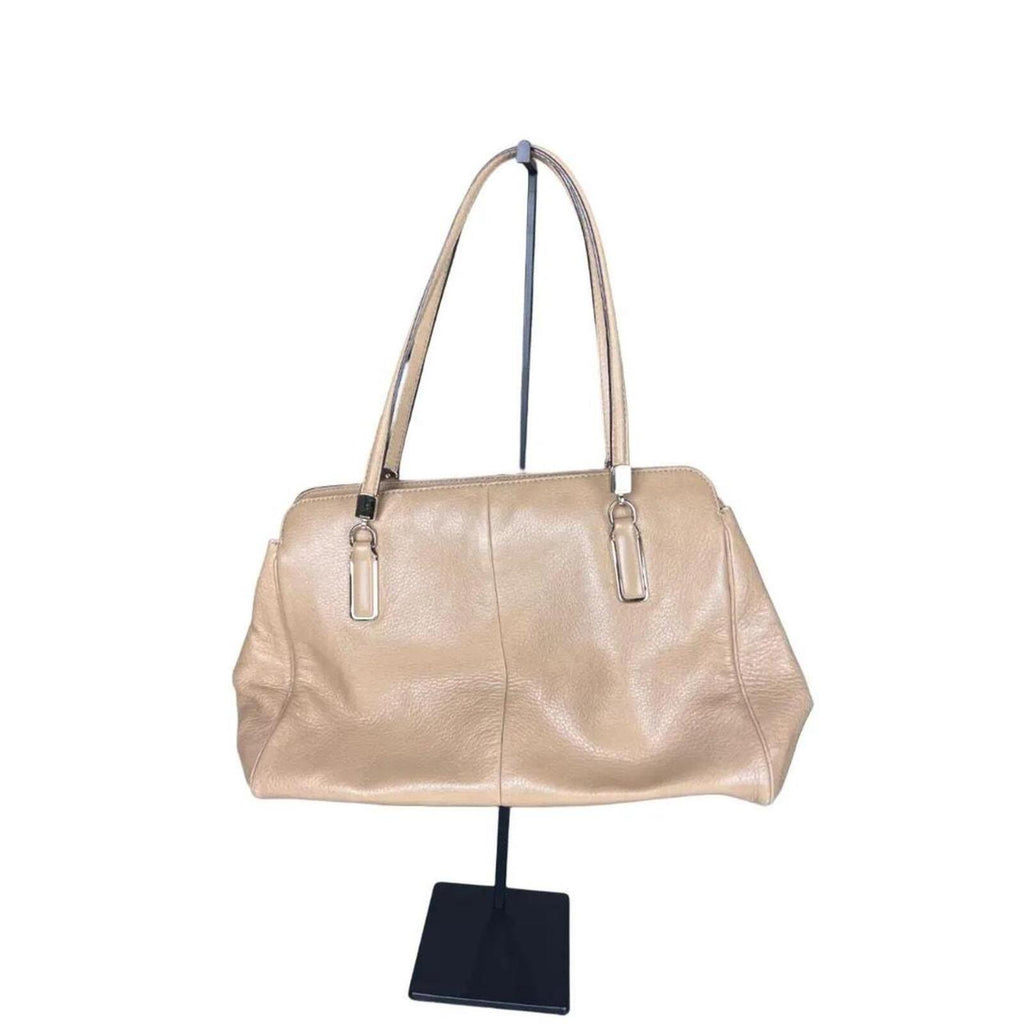 A stylish Coach Madison Kimberly Carryall Tote Bag in beige leather