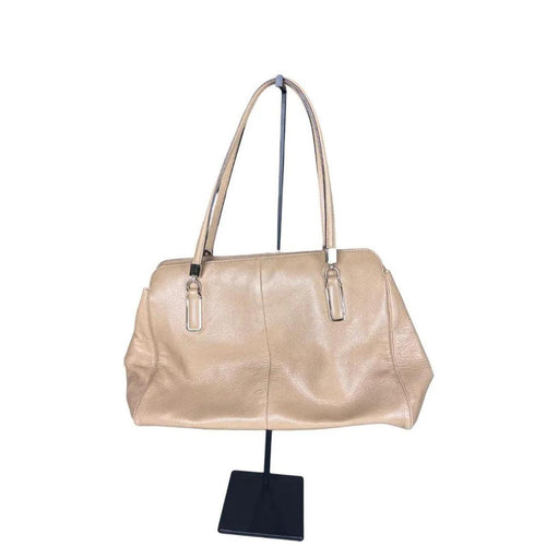 A stylish Coach Madison Kimberly Carryall Tote Bag in beige leather