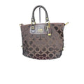 A Coach Julianne Tote Satchel in brown canvas and leather