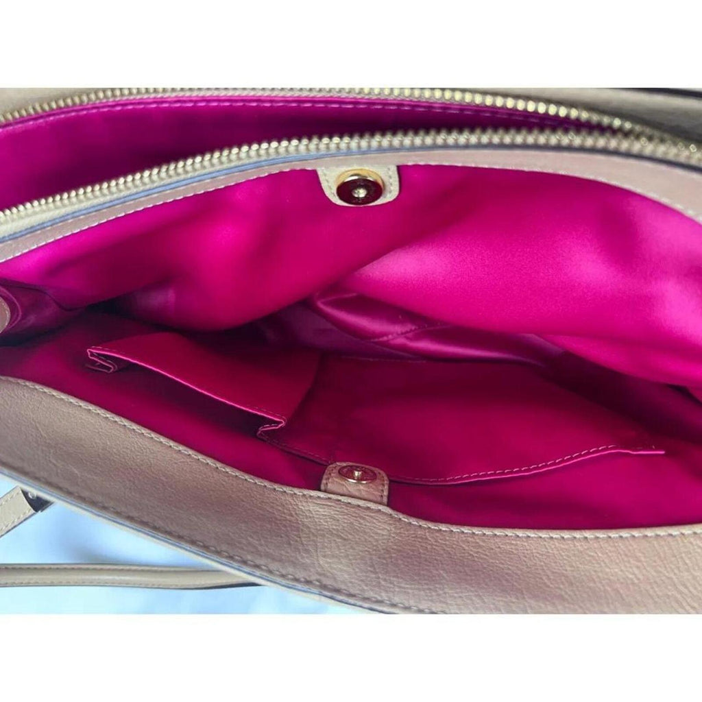 A stylish Coach Madison Kimberly Carryall Tote Bag in beige leather