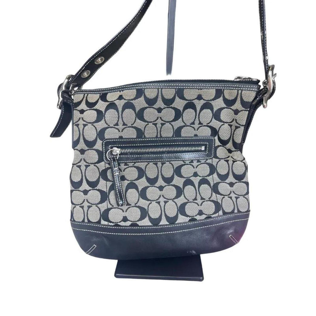 A classic Coach Signature Canvas Shoulder Bag in black and grey