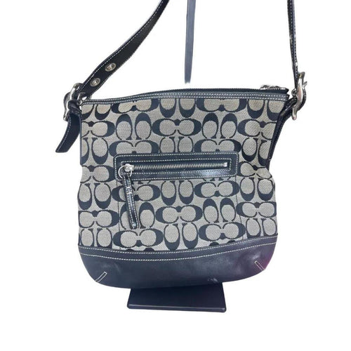 A classic Coach Signature Canvas Shoulder Bag in black and grey
