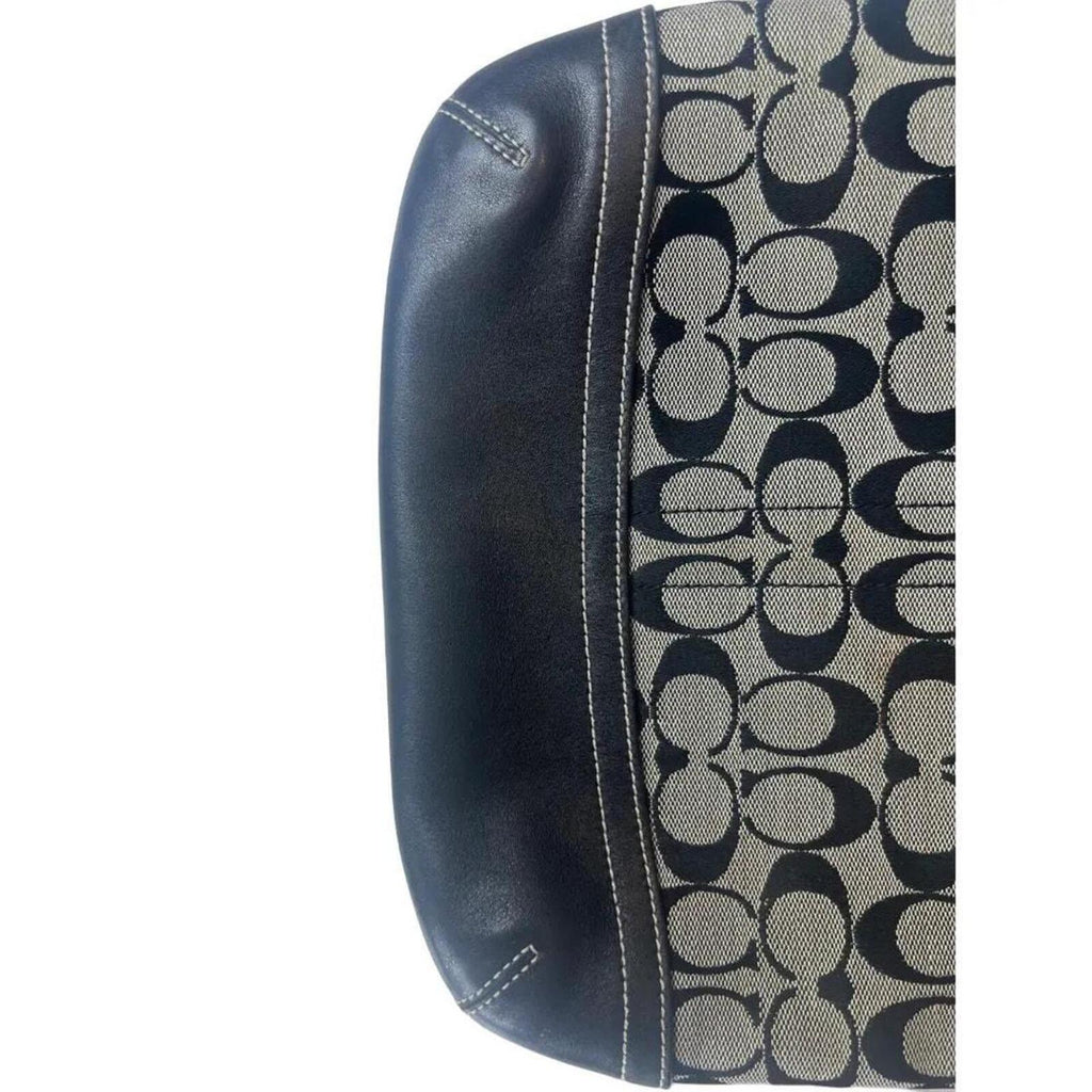 A classic Coach Signature Canvas Shoulder Bag in black and grey