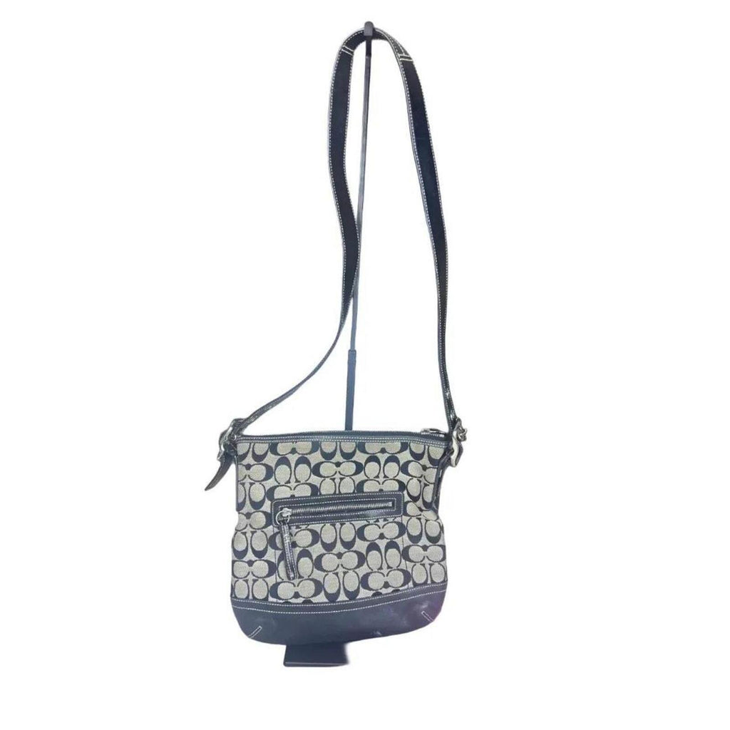 A classic Coach Signature Canvas Shoulder Bag in black and grey
