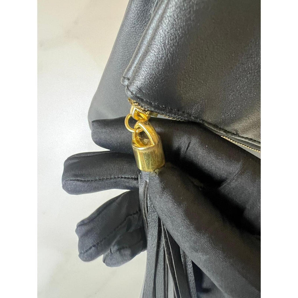 Givenchy black leather shoulder/clutch — sleek, minimalist designer bag in smooth black leather; versatile day-to-night elegance.